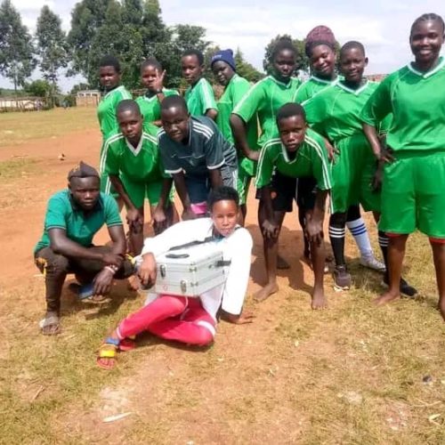 team first aider with her team before the game